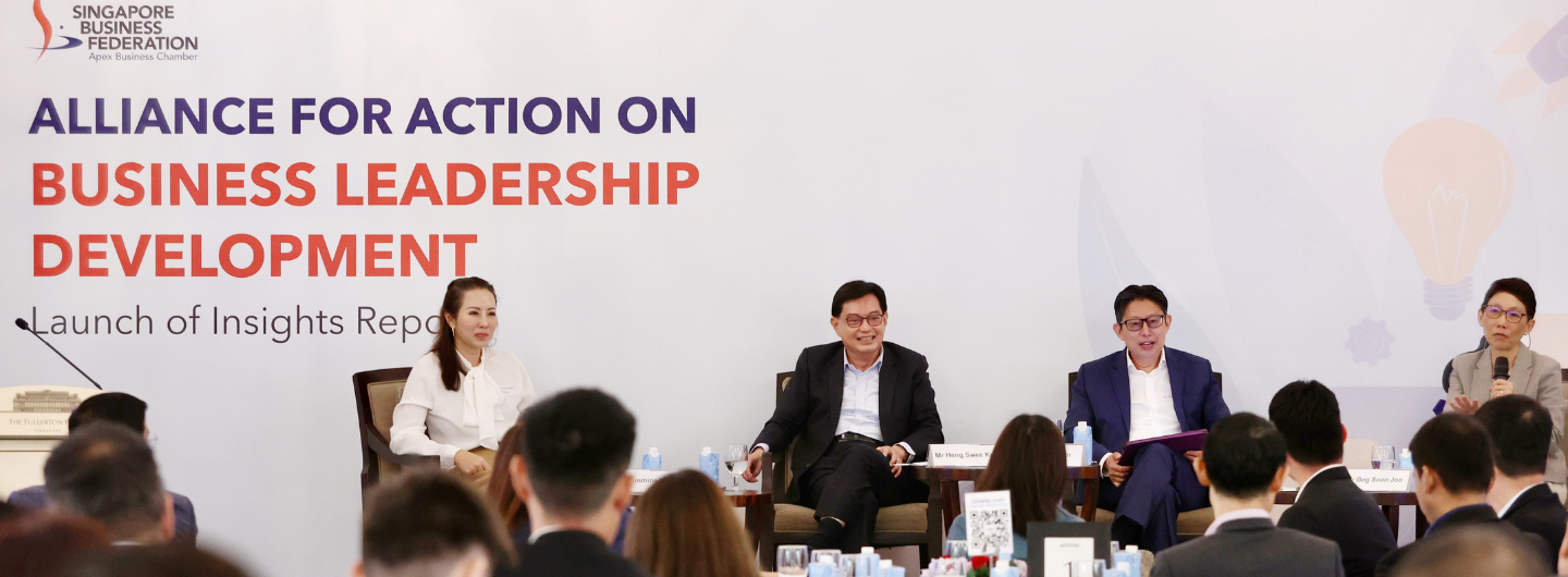 Panel at "Alliance for Action on Business Leadership Development" event with audience.